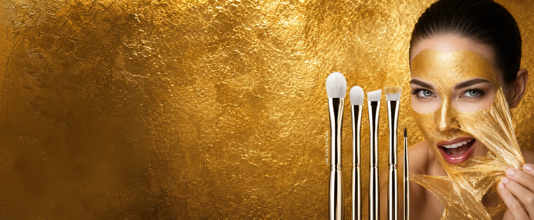 Model receiving a 24K gold facial treatment with a complete brush set